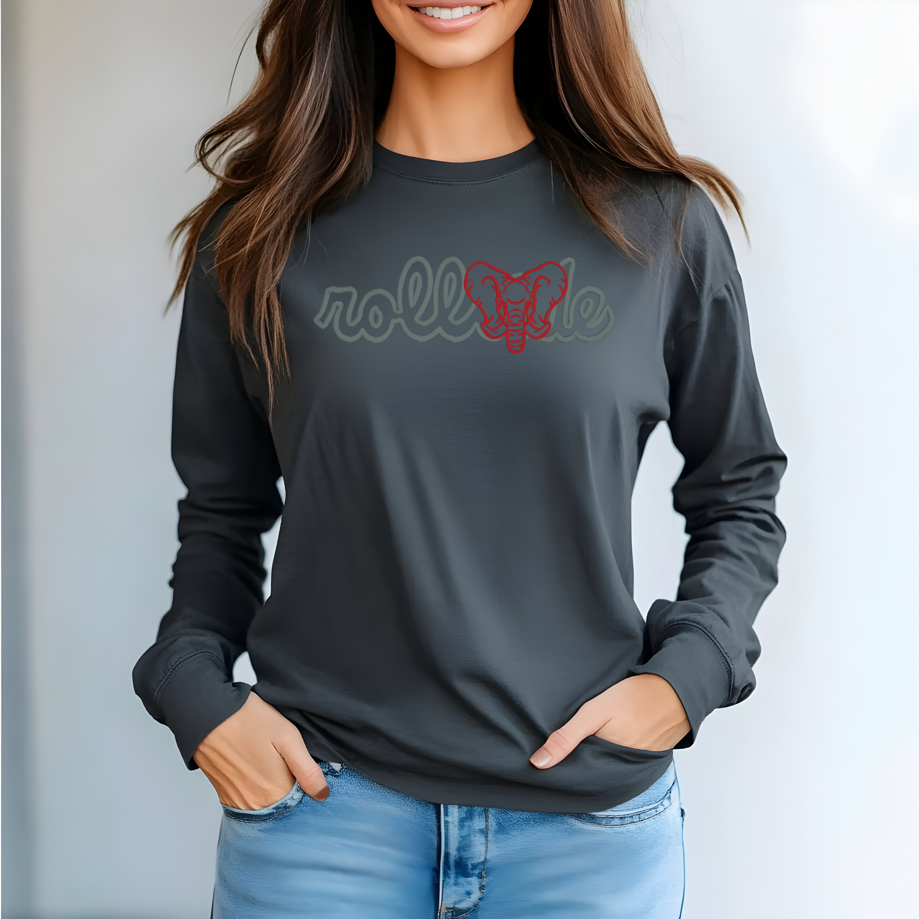 Person wearing a dark gray long-sleeve shirt with 'rolltide' printed on it, standing against a plain background.