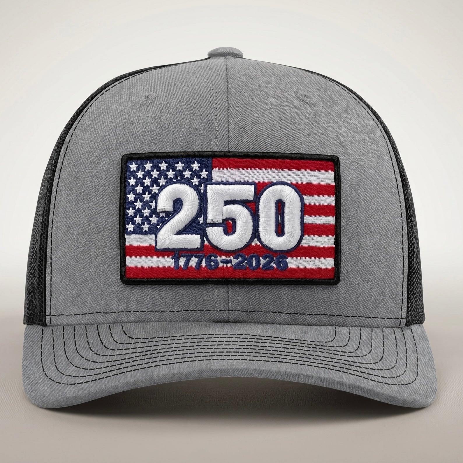 Gray cap with American flag patch celebrating 250 years on a light gray background