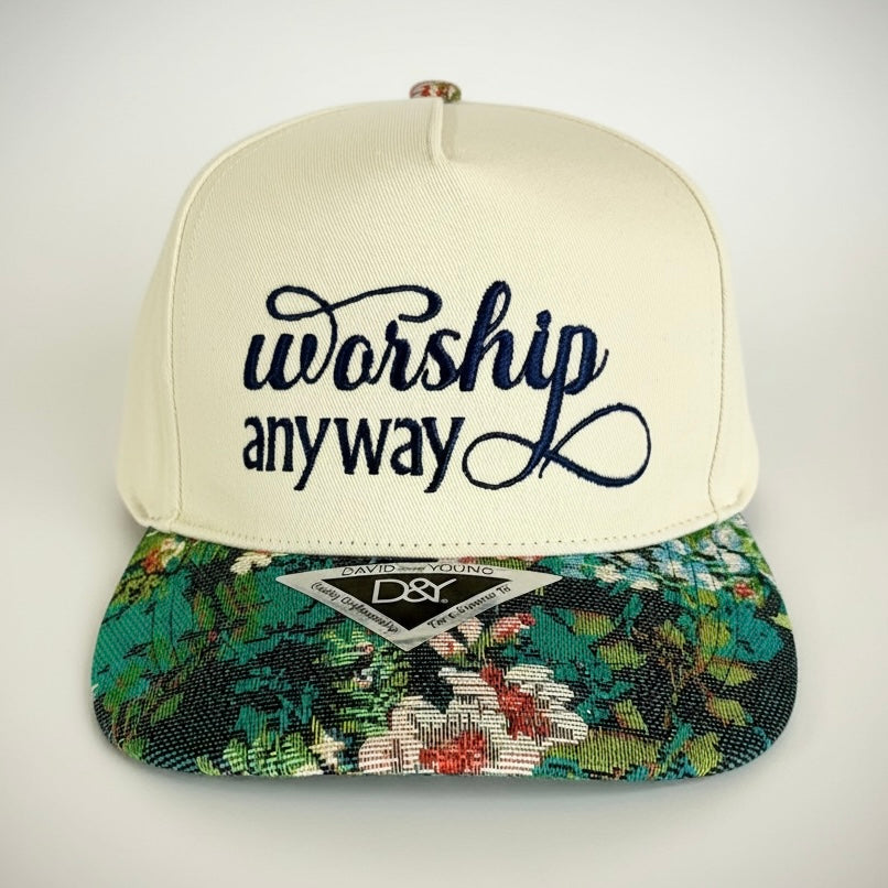 Cap with 'worship anyway' text and floral brim on a white background